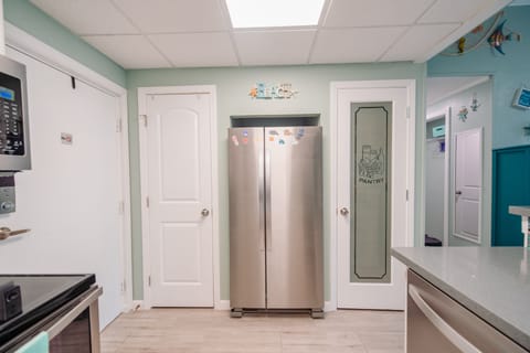 Private closet (left side). Refrigerator (center). Pantry (right side).