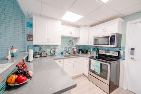 Fully stocked brand new kitchen with stainless steel appliances