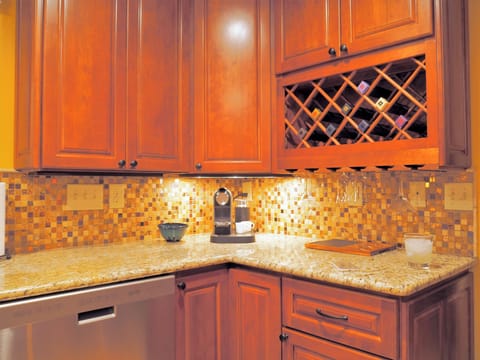Beautiful granite counters, under counter lighting and custom backsplash.