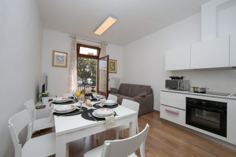 The living room with kitchen corner, dinner table and sofa