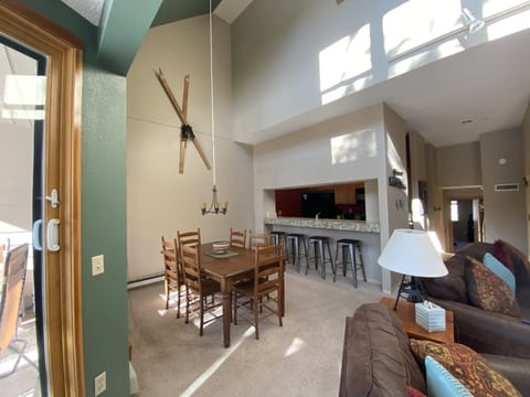 Dining area with bar stools at the counter for extra space.