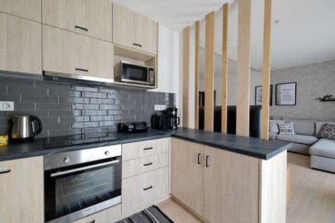 Deluxe Apartment, 3 Bedrooms, Balcony | Private kitchen | Full-size fridge, microwave, oven, stovetop