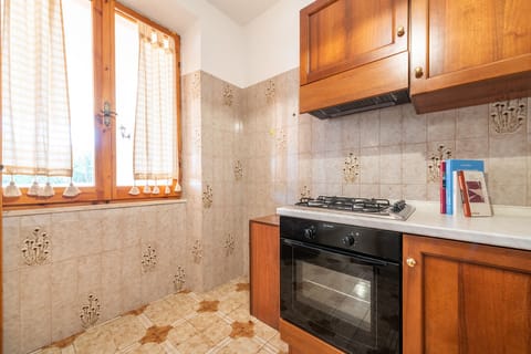 Apartment, 3 Bedrooms | Private kitchen | Full-size fridge, oven, stovetop, cookware/dishes/utensils