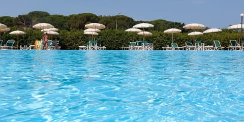 Seasonal outdoor pool, open 9:30 AM to 7:30 PM, pool umbrellas