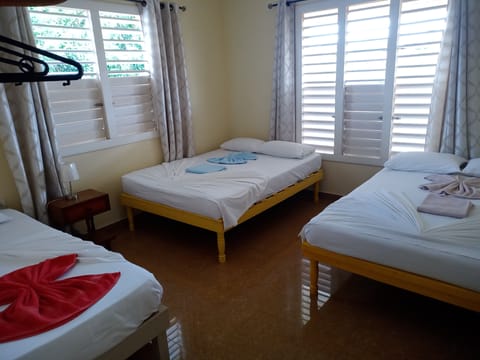 Superior Triple Room, Multiple Beds | Minibar, laptop workspace, iron/ironing board, bed sheets