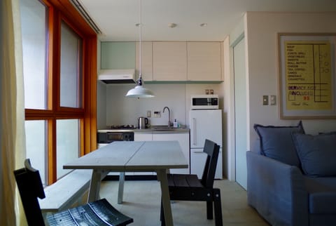 Room (B2) | Private kitchen | Full-size fridge, microwave, stovetop, electric kettle