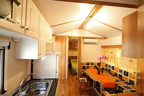 Mobile Home, 2 Bedrooms | Private kitchen | Full-size fridge, stovetop, coffee/tea maker, highchair