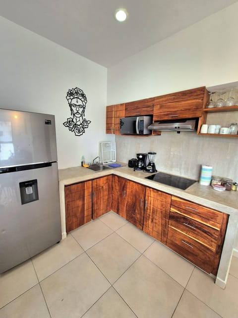 Elite Apartment, Multiple Beds, Non Smoking | Private kitchen | Full-size fridge, microwave, stovetop, cookware/dishes/utensils