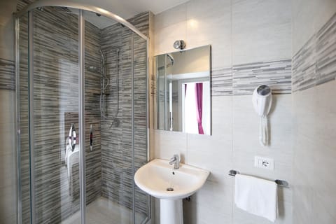 Shower, free toiletries, hair dryer, slippers