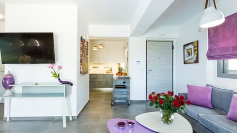 Living room area and kitchen next to it