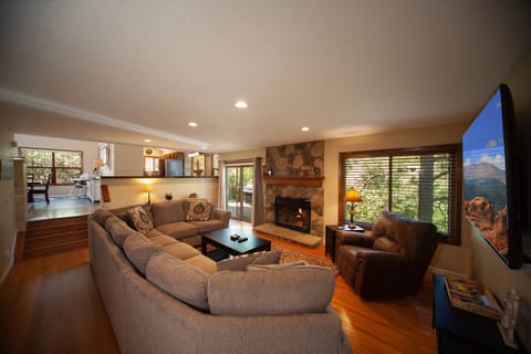 Grab a blanket, glass of wine & snuggle around the fire on our cozy couch.