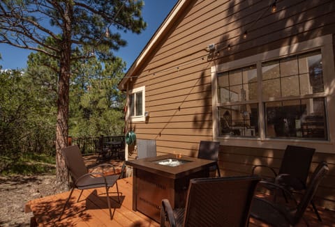 Secondary deck with fire pit, and overhead lights to enjoy year-round.