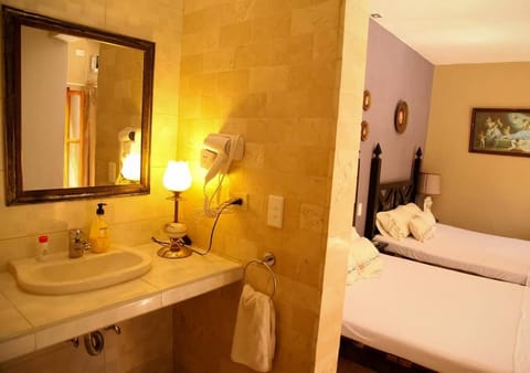 Modern 1 , 2 Queen Beds | Bathroom | Shower, rainfall showerhead, free toiletries, hair dryer