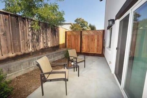 Step from the living room to your private patio—ideal for morning coffee or evening relaxation.