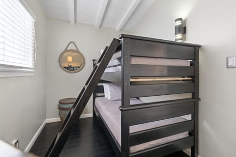 Bedroom #2 of rear upstairs unit provides Twin bunk bed set and linens.