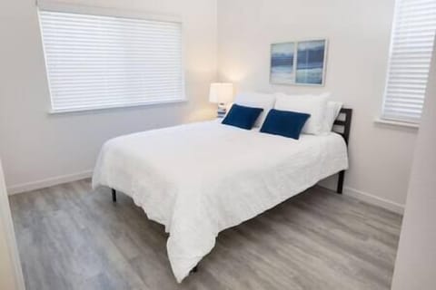 Bedroom 1 features a queen bed and serene olive orchard views, with a chance to spot wild turkeys.