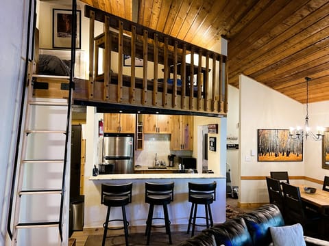 Loft area has 2 twin beds.  Photo from Living Room, ladder to Loft on the left