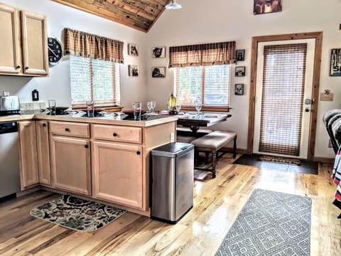 Gather around to cook, eat and chat in our open floor plan. Great views to dine by and plenty of seating with the extender. The table will seat up 10 and there are 3 bar stools.