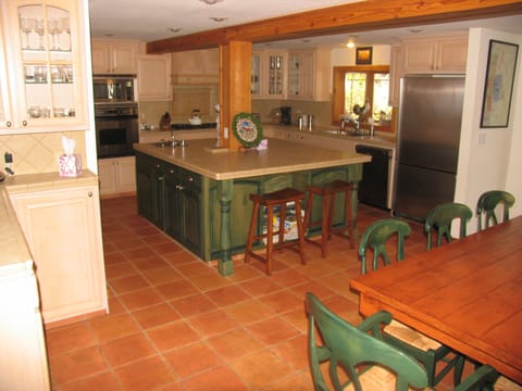Large kitchen and dining area. Two dishwashers, prep sink, trash compactor