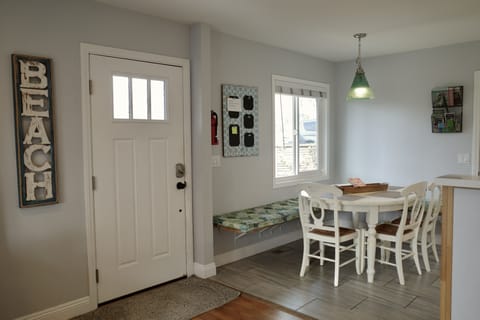 The front door opens to the fully fenced patio. 