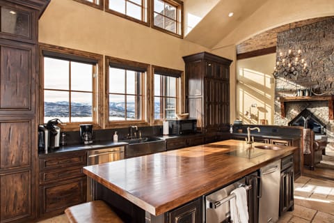 Chef's kitchen features plenty of pots, utensils, 2 dishwashers