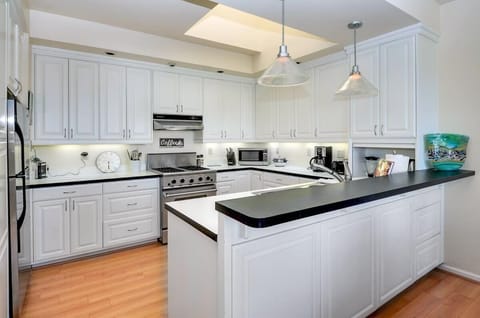 Large designer kitchen, lots of light, skylight, DCS range with large oven, and lots of counter space. It's open to the dining and living areas so the chef doesn't miss a thing!