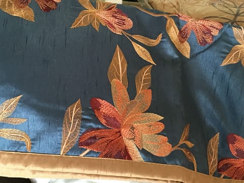 In winter we use a white duvet cover topped with an embroidered scarf (close up)