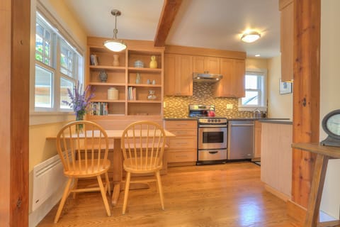 Dining area and kitchen. Try recipes from local cookbooks provided!