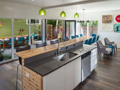 Designer touches, local artwork, & comfortable seating make this house amazing