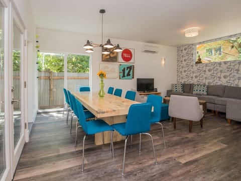 Large hand made dining table from salvaged wood makes for a wonderful dinner.