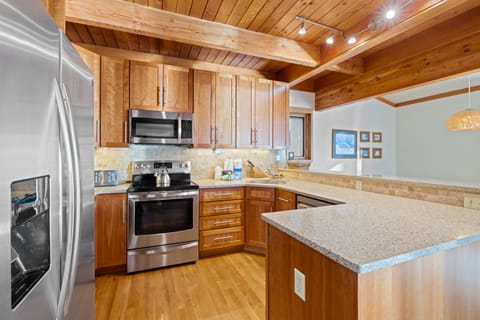 Kitchen with large counter and stove