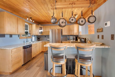 The open kitchen keeps the chefs connected while preparing a home cooked meal