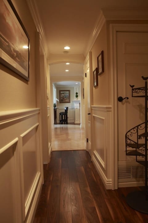 Crown molding and wood floor though to hallway