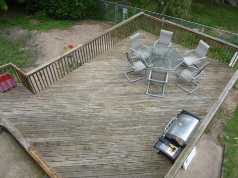 Huge deck with a grill, bags set and sand box!