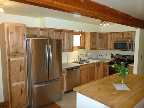 New kitchen with hickory cabinets, quartz countertop and a birch island!
