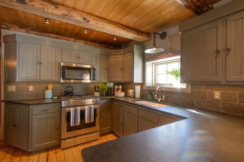 The kitchen. New glass and china - light and roomy.