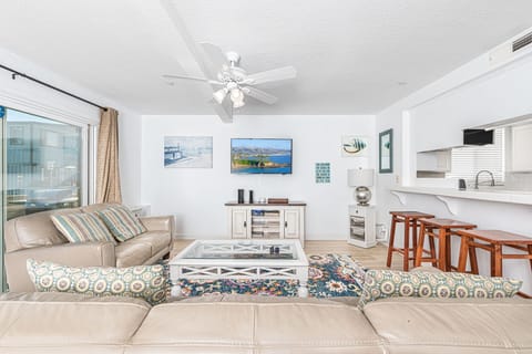 View of main living spaces from the front entry. Open floor plan between living, kitchen and dining areas.