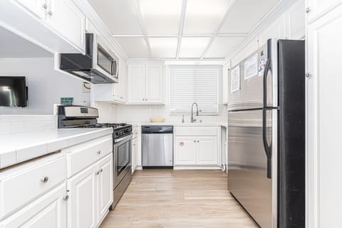 Kitchen is fully-stocked with dishes, cooking, baking and meal prep gear. All standard large and small appliances included. See listing description.