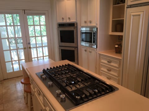 Kitchen with fridge, ice maker,range, double oven, microwave and wine fridge