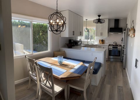 Total kitchen remodel 10/2023 with bench seating and chairs.