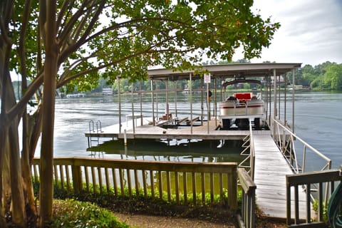 Dock and swim platform. The pontoon boat shown is not available for rent.