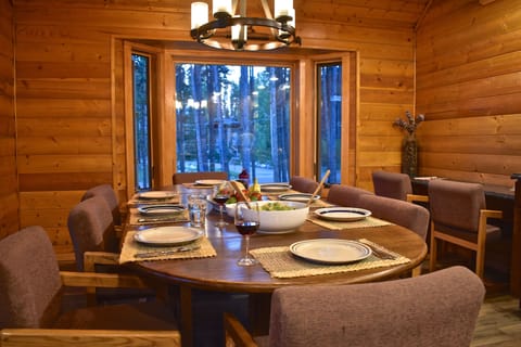 Large dining room table with additional seating at bar counter. Great views.