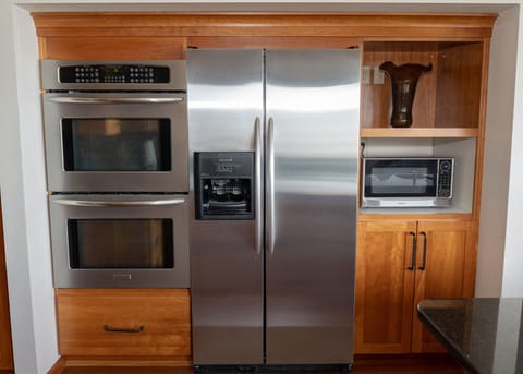 Two ovens, large refrigerator, and microwave with beautiful wood - a delight. 
