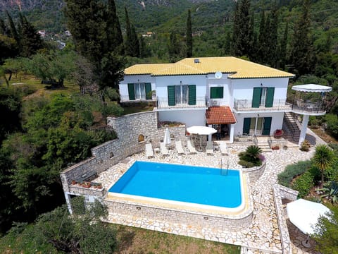Spacious villa with private pool, surrounded by greenery and peace.