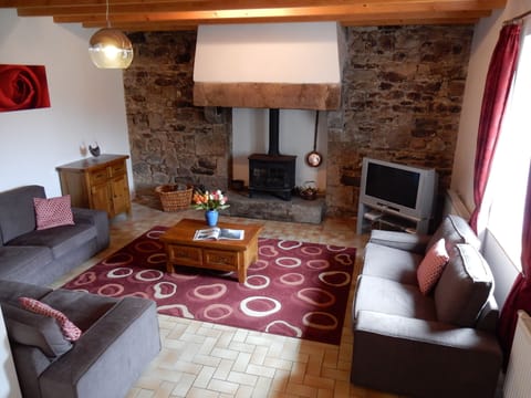 Large yet cosy lounge with wood burner, original features and plenty of seating