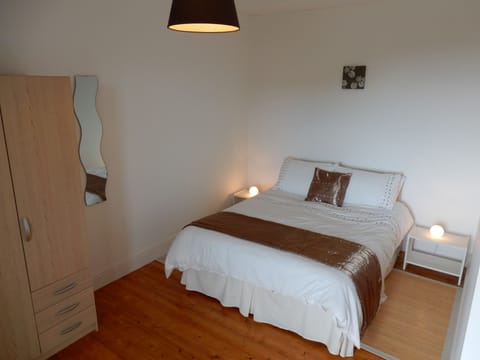 First Floor: Double bedroom (king size bed plus cot)