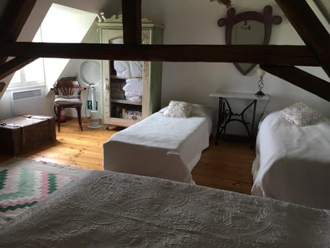 Top bedroom: 3 single beds + one pull-out. En suite bathroom. Travel cot option.