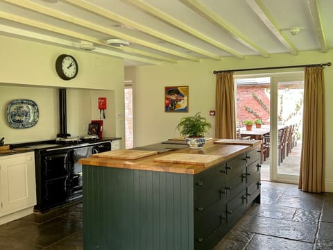 Great working kitchen with huge island and access to the outside eating area