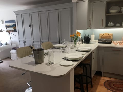 White bone china dinner service for  6, stone work surfaces