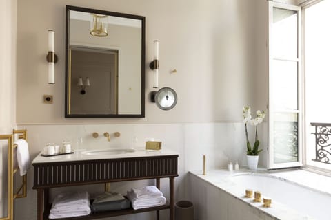 Suite | Bathroom | Designer toiletries, hair dryer, bathrobes, slippers